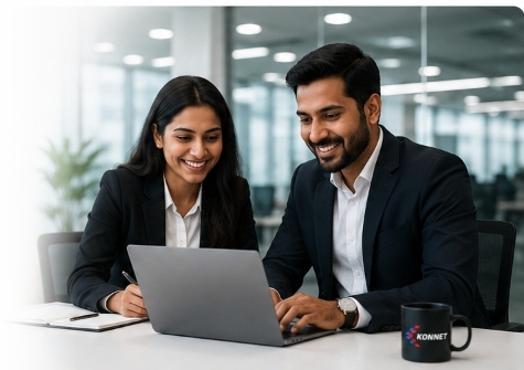 Konnet IT Experts collaborating with laptop